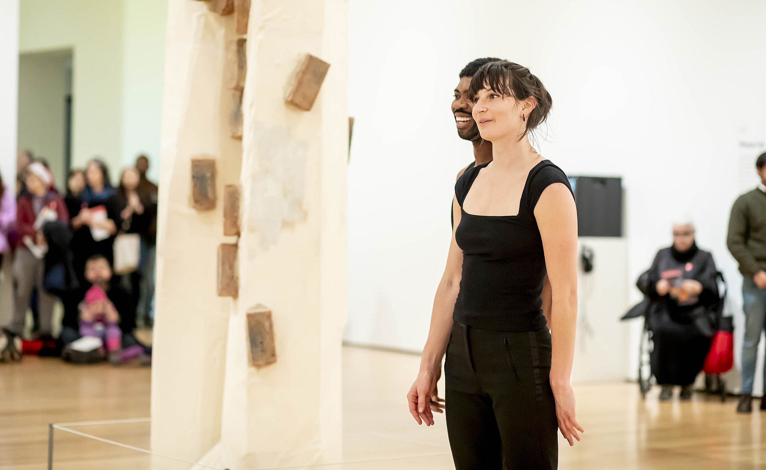 A photo of Frederick Moss and his dance partner Caitlin Canty in the Museum of Fine Arts