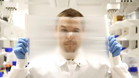 Researcher Peteris Lazovskis holds a Trellis Air membrane.