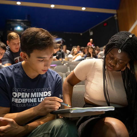 Students help each other during lecture
