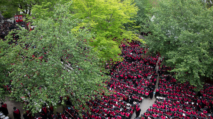 An aerial shot of graduates sitting at the Commencement ceremony