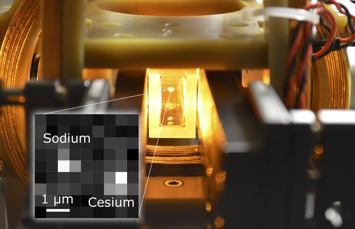 A laser-cooled cloud of a million sodium atoms suspended inside a glass cell vacuum apparatus