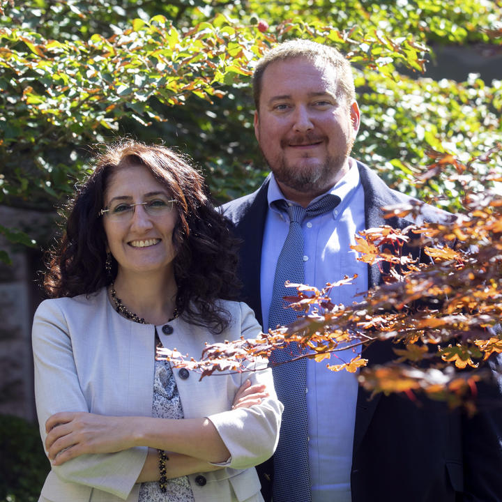 Dilek Dogutan (left) and Quentin Gilly are working with Paul Smith to test out a biofriendly fertilizer on Harvard's Cambridge campus