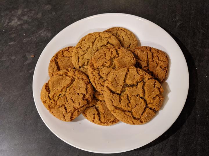 A photo of a plate of gingersnap cookies