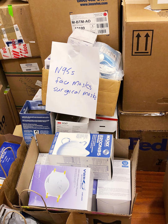 A photo of equipment and boxes stacked up to or even above shoulder height