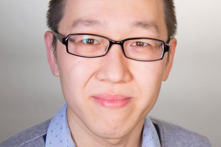 A headshot of Shaojie Song