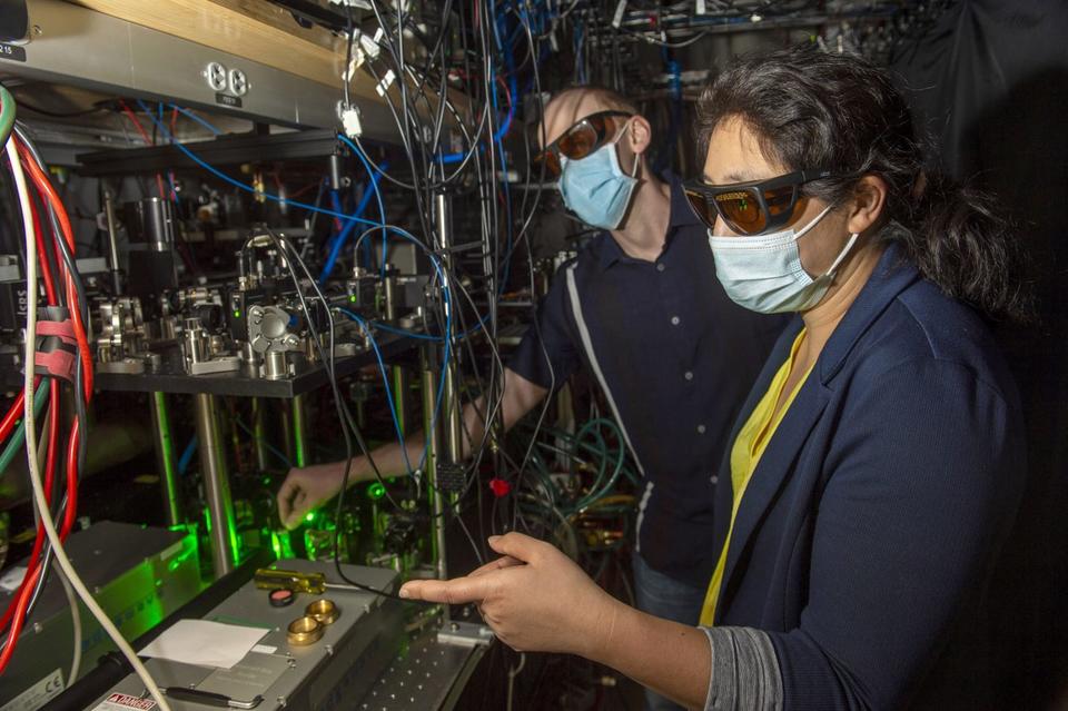 A photo of Kang-Kuen Ni and Matthew Nichols in their lab