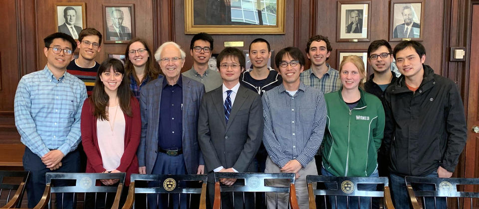 A group photo of 13 Gordon group members, including Professor Roy Gordon