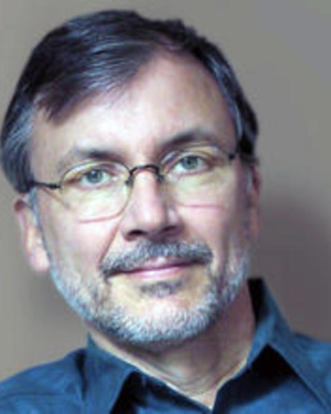 A headshot of Eric Heller